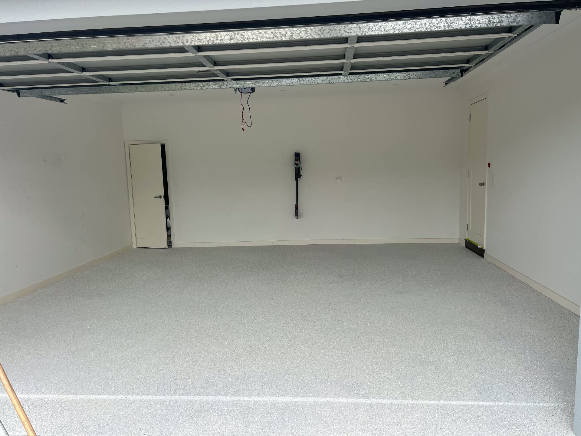 Freshly installed flake epoxy garage floor by Grit Epoxy on the Sunshine Coast
